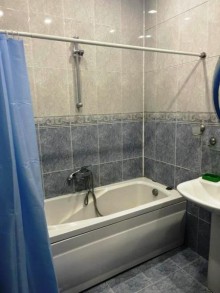 Nizami metrosunun yanında 12/5 mərtəbəli yeni tikili binada 4 otaqli ev, -8