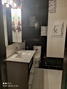 hazi aslanovda yeni tikili binada 2 otaqli menzil satilir, -9