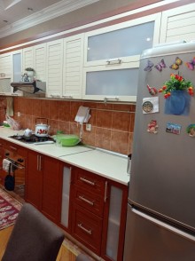 azadliqda 4 otaqli yeni binada menzil satilir, -15