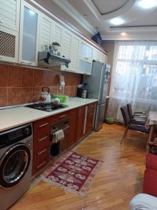 azadliqda 4 otaqli yeni binada menzil satilir, -16