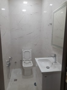 Azadliq metrosuna yaxin Yeni tikili 18 mərtəbəli binada 3 otaqli menzil almaq, -14