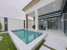 Mərdəkan qəsəbəsində 4 sotda hovuzlu modern bağ evi satılır