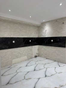 8-ci kilometr qəsəbəsində yerləşən yeni tikili binada 3 otaqlı, -4