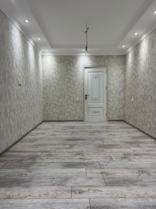 8-ci kilometr qəsəbəsində yerləşən yeni tikili binada 3 otaqlı, -9