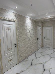 8-ci kilometr qəsəbəsində yerləşən yeni tikili binada 3 otaqlı, -11