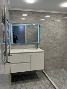 8-ci kilometr qəsəbəsində yerləşən yeni tikili binada 3 otaqlı, -14